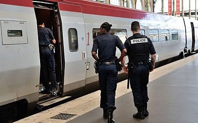 Member of Belgian and French police stay next to a Thalys train at the Brussels Midi - Zuid train station, on Saturday, August 22, 2015. Security has become more visible after an attack on Friday of a Thalys train traveling from Amsterdam to Paris. (Francois Walschaerts/AP)