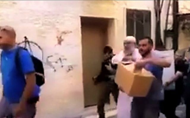 Israel Police arrest Sheikh Khaled Al-Mughrabi, who teaches at the Al-Aqsa Mosque on the Temple Mount, for allegedly including anti-Semitic content in his lessons, August 2, 2015. (screen capture: Palestinian Media Watch) 