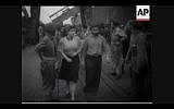 British troops transfer newly-arrived refugees onto ships heading back to Cyprus in 1946 (Screenshot of newsreel footage from YouTube)
