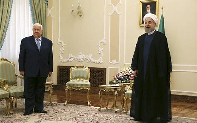 Hassan Rouhani, right, waited for the Syrian delegation as he was meeting with Syrian Foreign Minister Walid al-Moallem, left, at the presidency office in Tehran on Wednesday, Aug 5, 2015. (Vahid Salemi/ AP) Hassan Rouhani, right, waited for the Syrian delegation as he was meeting with Syrian Foreign Minister Walid al-Moallem, left, at the presidency office in Tehran on Wednesday, Aug 5, 2015. (Vahid Salemi/ AP)