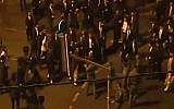 Ultra-Orthodox men clash with police in Jerusalem during an August 14, 2015, protest against the opening of the Yes Planet cinema complex on Shabbat. (screen capture: Channel 2)