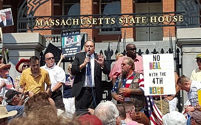 Up to 1,000 people gathered outside the Massachusetts State House in Boston to protest the proposed nuclear deal with Iran on August 30, 2015. Addressing the crowd is WRKO radio host Jeff Kuhner, host  and convener of the rally. (Matt Lebovic/The Times of Israel)