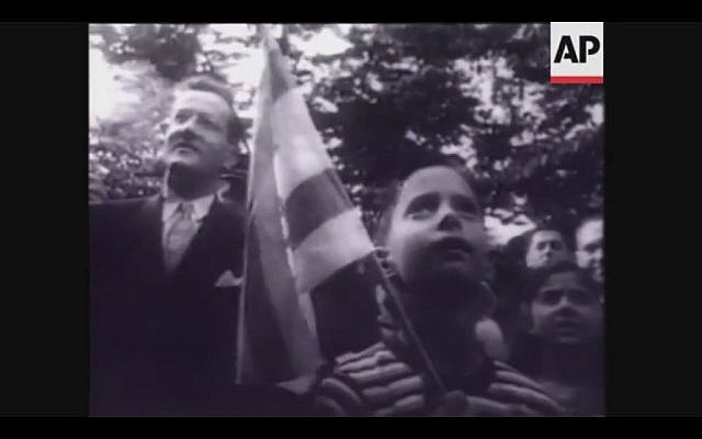 In 1948, people gathered outside the Jewish Agency building in Washington, D.C., to celebrate the birth of the Jewish State (Screenshot of newsreel footage from YouTube)