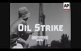 A young observer views an Israel oil derrick in 1955. The nation had just struck oil for the first time in the Heletz area south of Ashkelon. (Screenshot of newsreel footage from YouTube)