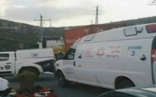 Rescue personnel and security forces attend the scene of a terror attack in the West Bank on Thursday, August 6, 2015. (screen capture: Channel 2)