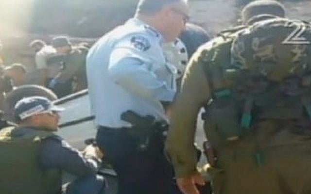 Rescue personnel and security forces attend the scene of a terror attack in the West Bank on Thursday, August 6, 2015. (screen capture: Channel 2)