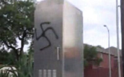 A swastika spray-painted on a structure near the Rodfei Sholom synagogue in San Antonio, Texas on August 11, 2015. (Screenshot/San Antonio Express News)
