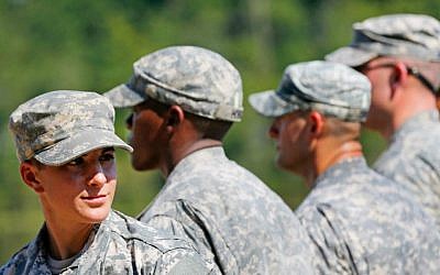 US Army Captain Kristen Griest, of Orange, Connecticut, left, smiles as she stands in formation during an Army Ranger School graduation ceremony, Friday, August 21, 2015, at Fort Benning, Georgia (AP/John Bazemore)