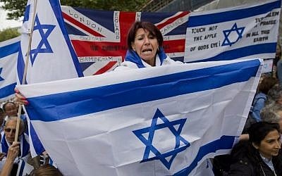 Pro-Israeli demonstrators carry the Israeli flag as they rally in support of the planned visit of Israeli Prime Minister Benjamin Netanyahu outside the gates of Downing Street in London on September 9, 2015. (AFP PHOTO / JUSTIN TALLIS) Pro-Israeli demonstrators carry the Israeli flag as they rally in support of the planned visit of Israeli Prime Minister Benjamin Netanyahu outside the gates of Downing Street in London on September 9, 2015. (AFP PHOTO / JUSTIN TALLIS)