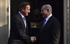 Britain's Prime Minister David Cameron, left, greets Prime Minister Benjamin Netanyahu outside 10 Downing Street ahead of a meeting in London, September 10, 2015. (AFP/Leon Neal)