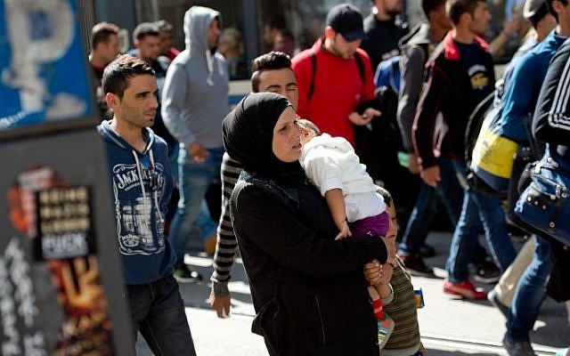 Migrants walk to a temporary shelter upon their arrival in Munich from Budapest on September 12, 2015. (Sven Hoppe/DPA/AFP) Migrants walk to a temporary shelter upon their arrival in Munich from Budapest on September 12, 2015. (Sven Hoppe/DPA/AFP)