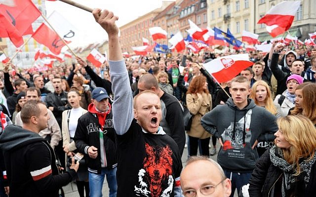 Right-wing demonstrators shout slogans as they take part in a protest against migrants in Warsaw on September 12, 2015. (AFP PHOTO / JANEK SKARZYNSKI) Right-wing demonstrators shout slogans as they take part in a protest against migrants in Warsaw on September 12, 2015. (AFP PHOTO / JANEK SKARZYNSKI)