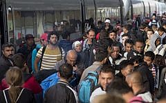 Refugees get out of a special train coming from Munich upon arrival at the railway station in Berlin Schoenefeld on September 13, 2015. (Axel Schmidt/AFP)