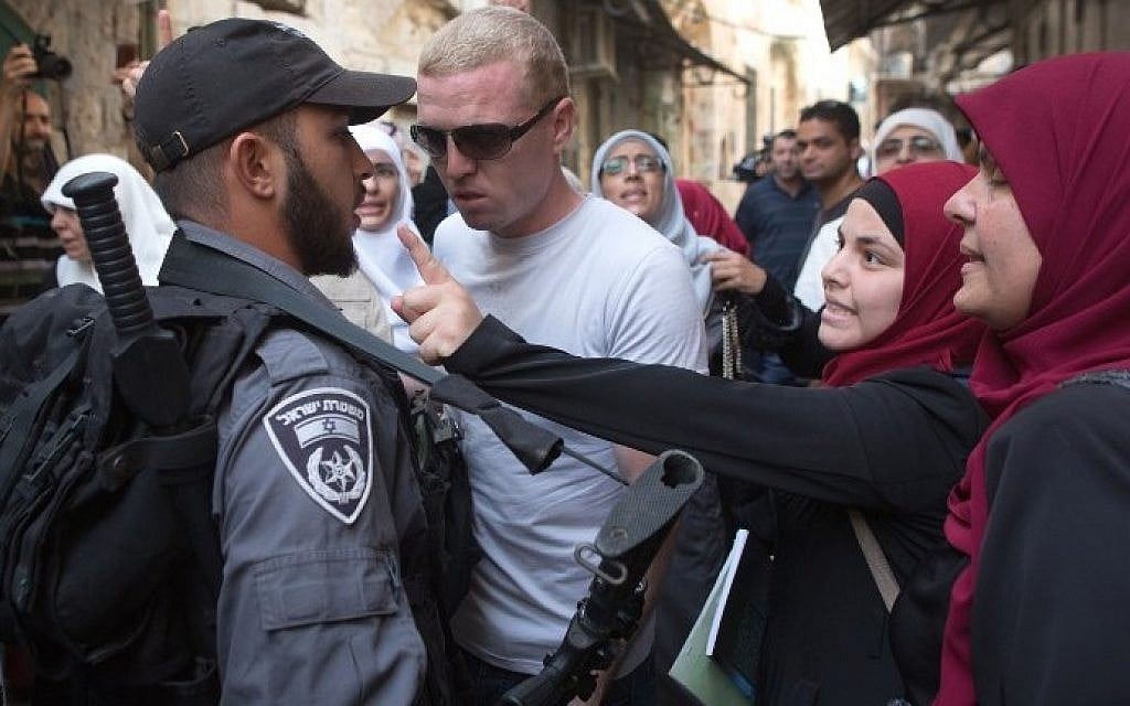 Palestinian women argue with Israeli policemen during a protest against Jewish groups visiting the Temple Mount, which houses Al-Aqsa Mosque in Jerusalem, on September 16, 2015. (AFP/Menahem Kahana) Palestinian women argue with Israeli policemen during a protest against Jewish groups visiting the Temple Mount, which houses Al-Aqsa Mosque in Jerusalem, on September 16, 2015. (AFP/Menahem Kahana)