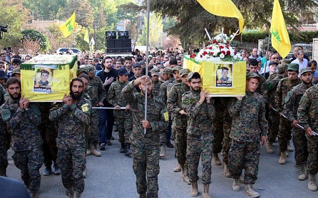 Hezbollah fighters carry the coffins of comrades who were killed in battles in Syria during their funeral on September 21, 2015 in the town of Baalbek in eastern Lebanon's Bekaa Valley. (AFP/STR) Hezbollah fighters carry the coffins of comrades who were killed in battles in Syria during their funeral on September 21, 2015 in the town of Baalbek in eastern Lebanon's Bekaa Valley. (AFP/STR)