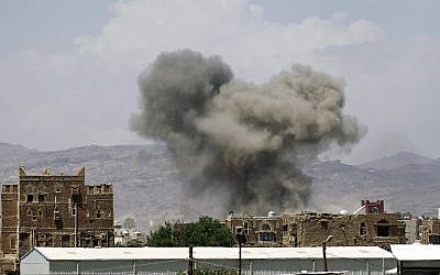 Illustrative image of smoke billowing from buildings after reported air strikes by the Saudi-led coalition on arms warehouses at Al-Dailami air base, on September 29, 2015, north of the Yemeni capital Sanaa. (AFP/Mohammed Huwais)