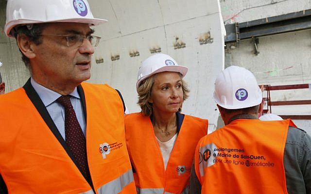 Head of the Hauts-de-Seine general council Patrick Devedjian (L) and top candidate of Les Republicains right-wing party for the French regional elections in Ile-de-France Valerie Pecresse (C) visit the building site of the extension of the subway line 14, on September 9, 2015 in Paris. (AFP PHOTO / PATRICK KOVARIK) Head of the Hauts-de-Seine general council Patrick Devedjian (L) and top candidate of Les Republicains right-wing party for the French regional elections in Ile-de-France Valerie Pecresse (C) visit the building site of the extension of the subway line 14, on September 9, 2015 in Paris. (AFP PHOTO / PATRICK KOVARIK)