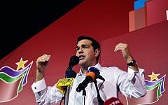 Greece's Syriza party leader Alexis Tsipras speaks with supporters after his party's victory in the Greek general elections at his campaign headquarters in Athens on September 20, 2015. (AFP Photo/Louisa Gouliamaki)