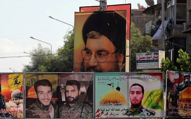 File: A file picture taken on September 21, 2015 shows a portrait of Hassan Nasrallah (top), the head of Lebanon's militant Shiite Muslim movement Hezbollah, and portraits of pro-government force members killed in combat displayed on a street in the Syrian capital, Damascus. (AFP PHOTO/JOSEPH EID) File: A file picture taken on September 21, 2015 shows a portrait of Hassan Nasrallah (top), the head of Lebanon's militant Shiite Muslim movement Hezbollah, and portraits of pro-government force members killed in combat displayed on a street in the Syrian capital, Damascus. (AFP PHOTO/JOSEPH EID)