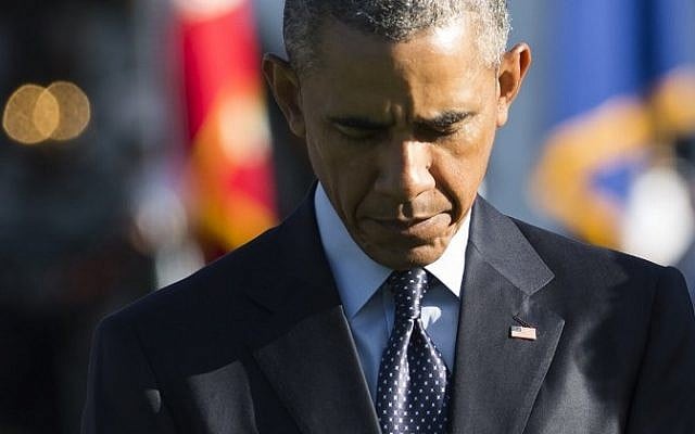 US President Barack Obama observes a moment of silence on the South Lawn of the White House in Washington, DC, September 11, 2015, to mark the 14th anniversary of the 9/11 attacks on the United States. (AFP / SAUL LOEBAFP PHOTO / SAUL LOEB) US President Barack Obama observes a moment of silence on the South Lawn of the White House in Washington, DC, September 11, 2015, to mark the 14th anniversary of the 9/11 attacks on the United States. (AFP / SAUL LOEBAFP PHOTO / SAUL LOEB)