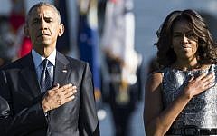 US President Barack Obama and First Lady Michelle Obama stand on the South Lawn of the White House in Washington, DC, September 11, 2015, to mark the 14th anniversary of the 9/11 attacks on the United States. (AFP/ SAUL LOEB)