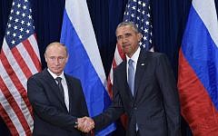 US President Barack Obama and Russia's President Vladimir Putin shake hands while posing for a photo ahead of a bilateral meeting on the sidelines of the 70th session of the UN General Assembly at the United Nations headquarters on September 28, 2015 in New York. (Mandel Ngan/AFP)