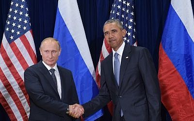 US President Barack Obama and Russia's President Vladimir Putin shake hands while posing for a photo ahead of a bilateral meeting on the sidelines of the 70th session of the UN General Assembly at the United Nations headquarters on September 28, 2015 in New York. (Mandel Ngan/AFP)