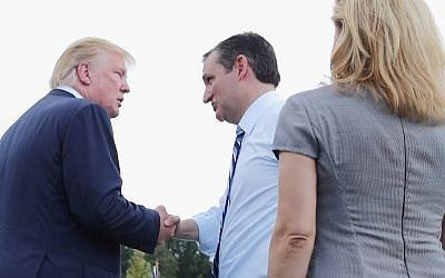 Republican presidential candidates Donald Trump (left) and Sen. Ted Cruz (center) and his wife, Heidi Nelson Cruz, meet on stage during a rally against the Iran nuclear deal at the Capitol in Washington, DC, on September 9, 2015. (Chip Somodevilla/Getty Images/AFP)