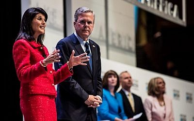 South Carolina Governor Nikki Haley (left) talks about education with former Florida Governor and republican presidential candidate Jeb Bush at the Heritage Action Presidential Candidate Forum September 18, 2015 in Greenville, South Carolina. (Sean Rayford/Getty Images/AFP)