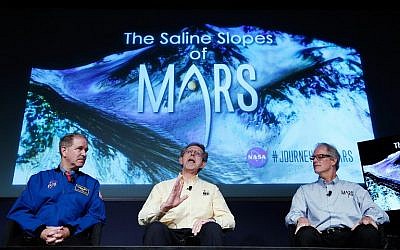 John Grunsfeld, associate administrator at NASA's Science Mission Directorate, Jim Green, director of planetary science at NASA Headquarters and Michael Meyer, lead scientist for the Mars Exploration Program at NASA Headquarters, answer questions during a press conference where NASA announced new findings that provide the "strongest evidence yet" of salty liquid water currently existing on Mars on September 28, 2015 in Washington, DC. (Win McNamee/Getty Images/AFP)