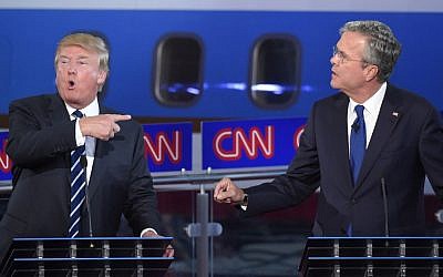 Republican presidential candidates, former Florida Gov. Jeb Bush, right, and Donald Trump both speak during the CNN Republican presidential debate at the Ronald Reagan Presidential Library and Museum on Wednesday, Sept. 16, 2015, in Simi Valley, Calif. (AP Photo/Mark J. Terrill)