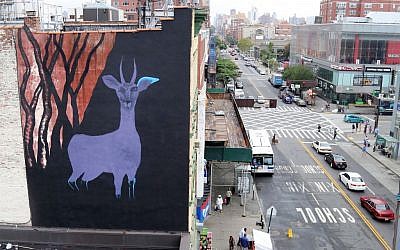 A large gazelle mural is shown on the side of a building in the Harlem neighborhood of New York. The mural is one of about half a dozen that have been commissioned as part of a campaign to raise awareness for a nonprofit created by Maziar Bahari, the journalist who spent 118 days in an Iranian jail after an appearance on “The Daily Show with Jon Stewart. The murals are being painted on buildings around the city as the United Nations General Assembly kicks off Tuesday, Sept. 15. Bahari hopes the art will attract the attention of diplomats and spark a conversation about human rights. (AP Photo/Mike Balsamo)