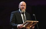 Illustrative: UK Chief Rabbi Ephraim Mirvis gives a speech as he attends a Holocaust Memorial Day Ceremony at Central Hall Westminster, on January 27, 2015. (AP/Chris Jackson)