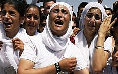 Yazidi Kurdish women chant slogans during a protest against the Islamic State group's invasion of Sinjar city, in Dohuk, Iraq, August 3, 2015. (AP/Seivan M. Salem)