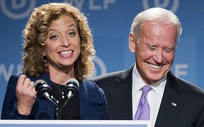 Vice President Joe Biden, right, laughs as he is introduced by DNC Chair Rep. Debbie Wasserman Schultz, D-Florida, at the DNC Women's Leadership conference in Washington, Friday, September 19, 2014. (AP/Manuel Balce Ceneta)