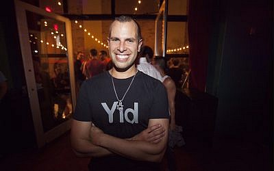 Jayson Littman, founder of the gay Jewish “social start-up” Hebro, at the “High Homodays” party in 2014. (JTA/Santiago Felipe)