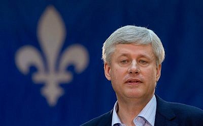 In this Friday, Sept. 11, 2015 file photo, Conservative Leader Stephen Harper speaks to supporters during a campaign stop in Victoriaville, Quebec, Canada. (Adrian Wyld/The Canadian Press via AP)