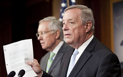 Senate Minority Whip Richard Durbin of Ill., right, with Senate Minority Leader Harry Reid of Nev., holds up a copy of a letter signed by Senate Republicans, that was sent to the leader of Iran, as they answer questions for reporters following the Senate vote on the Iran nuclear agreement on Capitol Hill in Washington on Sept. 10, 2015.  (AP Photo/Pablo Martinez Monsivais, File)