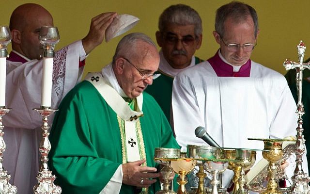 A priest places a skullcap on Pope Francis during Mass at Revolution Plaza in Havana, Cuba, September 20, 2015. (AP/Ramon Espinosa)