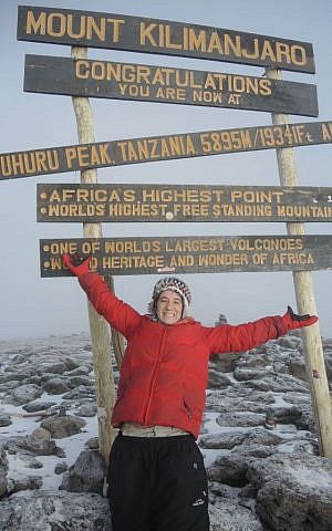 Victory at the rooftop of Africa. Only made possible with the help of an incredible team of guides and porters. (Melanie Lidman/Times of Israel) Victory at the rooftop of Africa. Only made possible with the help of an incredible team of guides and porters. (Melanie Lidman/Times of Israel)