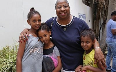 Rev. Deedee Coleman of Russel Street Missionary Baptist Church in Detroit posing with African migrant children in Tel Aviv. Aug. 30, 2015. JTA) Rev. Deedee Coleman of Russel Street Missionary Baptist Church in Detroit posing with African migrant children in Tel Aviv. Aug. 30, 2015. JTA)