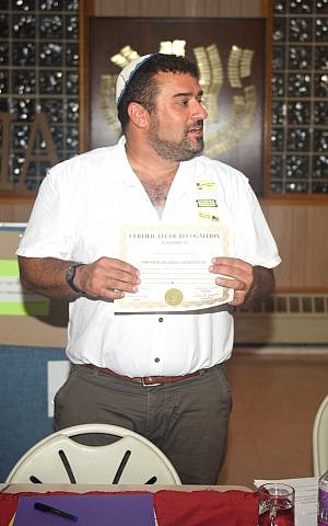 Rabbi Brent Spodek holds up a mock certificate drafted by Israeli-American artist Ori Alon at a recent Days of Awe workshop at his Beacon Hebrew Alliance synagogue. (courtesy) Rabbi Brent Spodek holds up a mock certificate drafted by Israeli-American artist Ori Alon at a recent Days of Awe workshop at his Beacon Hebrew Alliance synagogue. (courtesy)