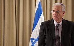 Dr. Itzhak Kadman, head of the National Council on Children's Welfare, delivers his annual report to Presidet Shimon Peres (not seen). Dec 18 2012. (Uri Lenz/Flash 90)