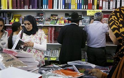 Arabs and Jews buy school supplies at a store in downtown Jerusalem, August 26, 2013. (Miriam Alster/Flash90)