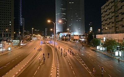 Israelis ride their bicycles on empty roads in Tel Aviv, on Yom Kippur, the holiest of Jewish holidays. The photo was taken on October 03, 2014. (Danielle Shitrit/Flash 90) 