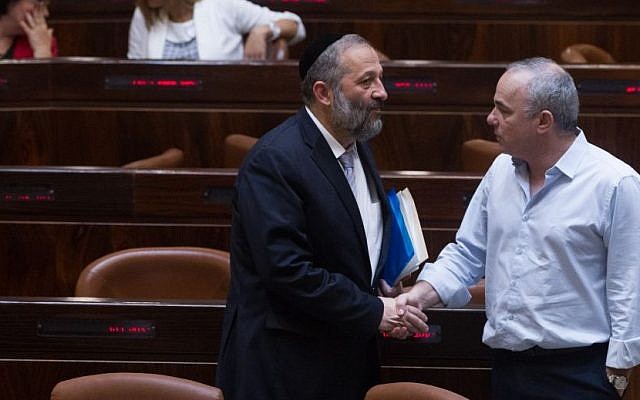 Economy Minister Aryeh Deri speaks with Energy Minister Yuval Steinitz during a plenum session in the Knesset on June 17, 2015. (Miriam Alster/FLASH90 Economy Minister Aryeh Deri speaks with Energy Minister Yuval Steinitz during a plenum session in the Knesset on June 17, 2015. (Miriam Alster/FLASH90
