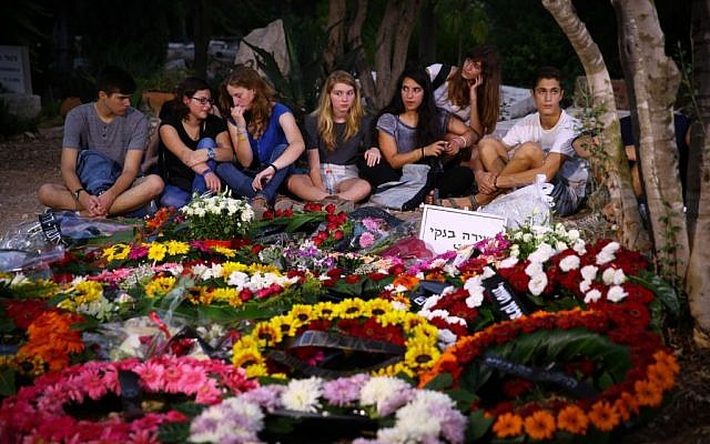 Friends of Shira Banki, who was stabbed and killed as she marched in Jerusalem's Gay Pride Parade, visit her grave following her burial on August 3, 2015. (Flash 90)