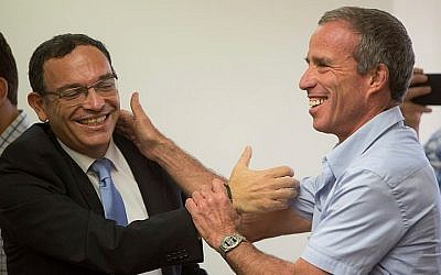 Outgoing Yesh Atid parliament member Shai Piron (L) seen with incoming Yesh Atid parliament member Elazar Stern at a Yesh Atid party meeting at the Knesset, Israel's parliament in Jerusalem on August 2, 2015. (Yonatan Sindel/Flash90)