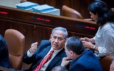 Prime Minister Benjamin Netanyahu speaks with Minister of Justice Ayelet Shaked and Minister of Transportation Yisrael Katz at the Knesset on September 2, 2015. (Photo by Yonatan Sindel/Flash90)