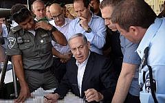 Prime Minister Benjamin Netanyahu, Minister of Public Security Gilad Erdan and Jerusalem mayor Nir Barkat tour Jerusalem following the recent clashes in Jerusalem's Old City, on September 16, 2015. (Amos Ben Gershom/GPO)